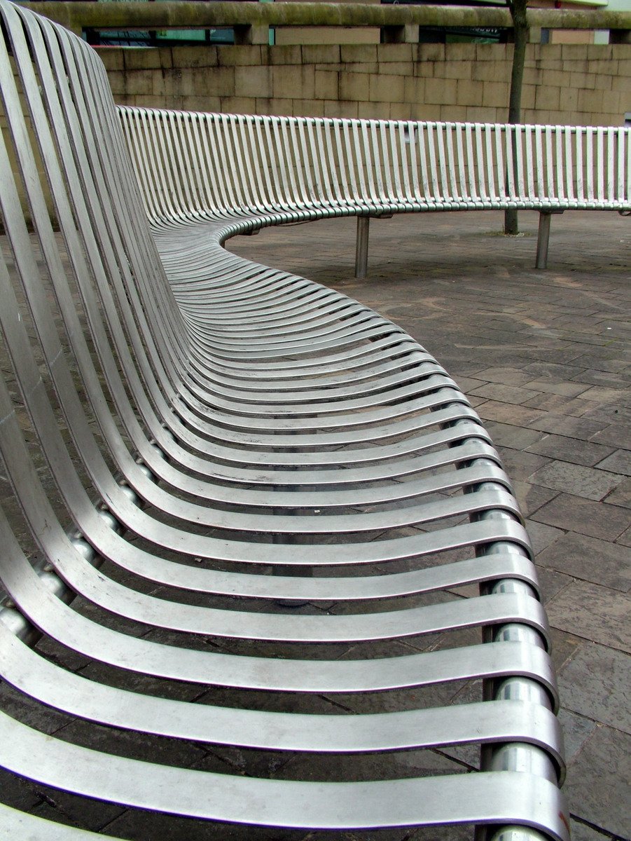 an image of a white bench lined with benches