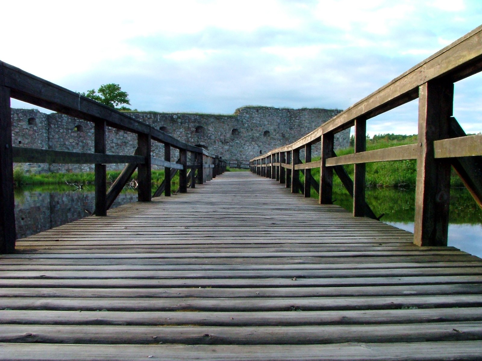 a wooden bridge over a body of water