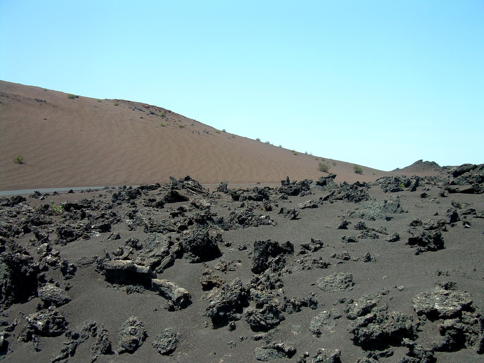 the desert has very large rocks and sand dunes