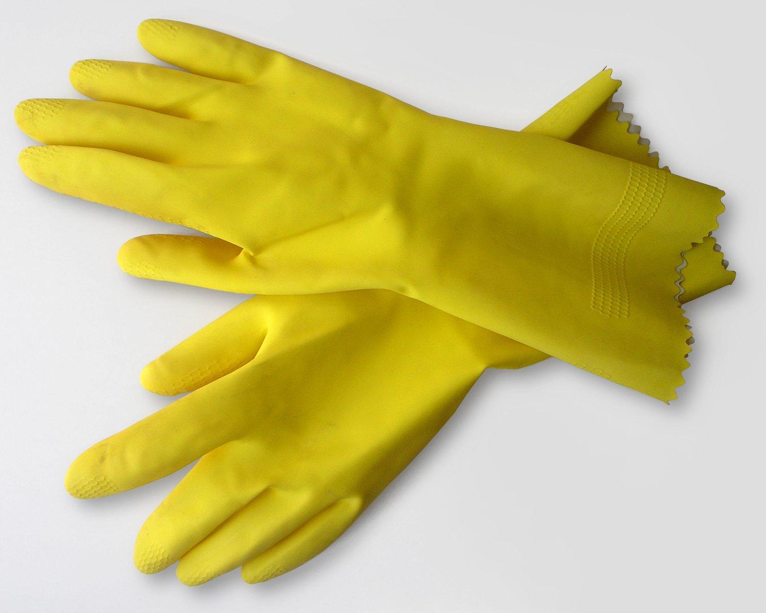 yellow gloves with two sides on the left and one side has a hole in the middle of it