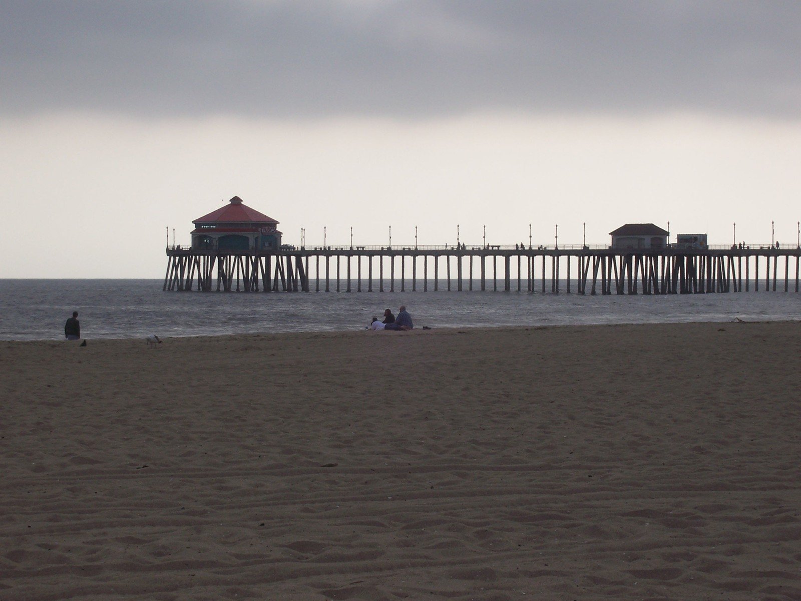 a boardwalk is shown at the beach in front of the water