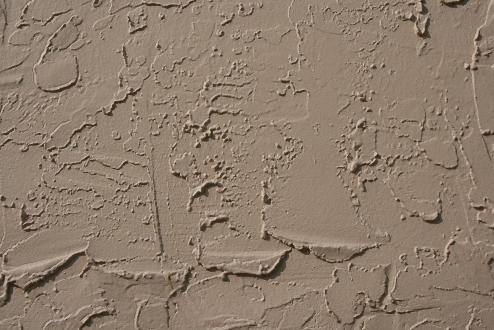 a close up of a wall that is painted brown