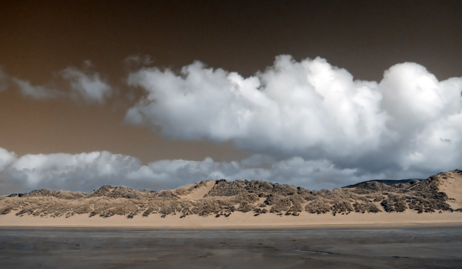 a picture with many clouds above the mountains