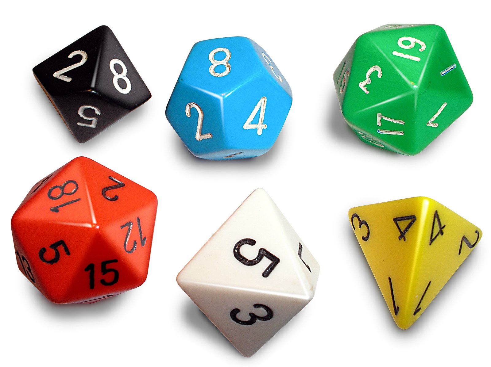 several different colored and black dice in various shapes