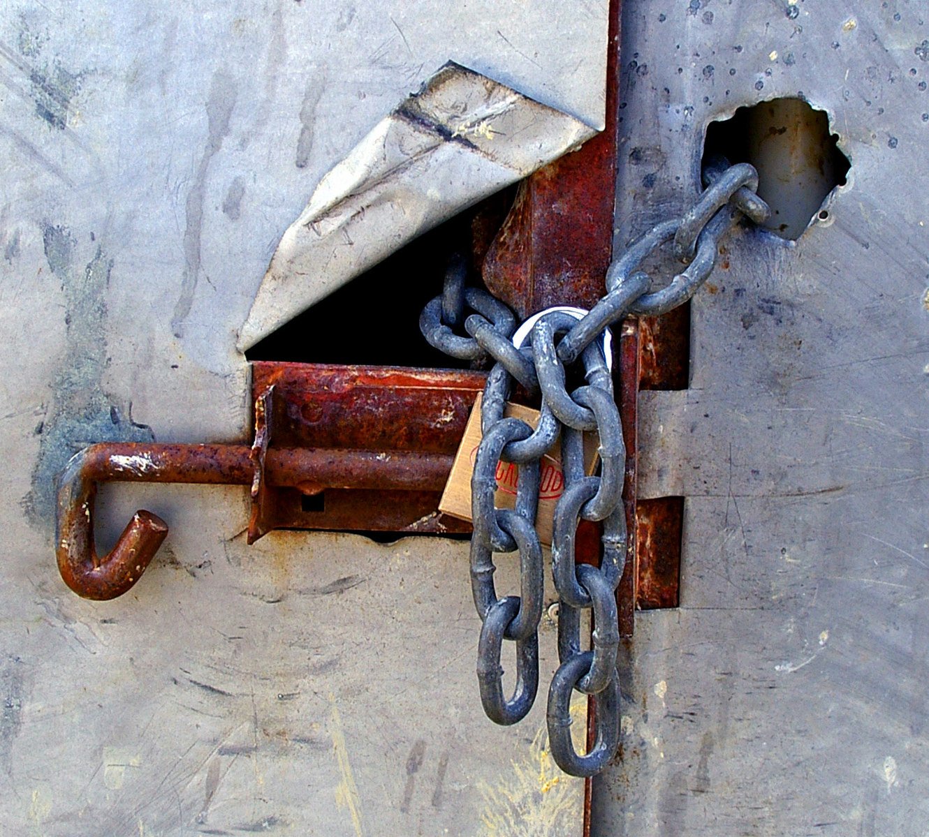 rusted gate with chain and padlock lock