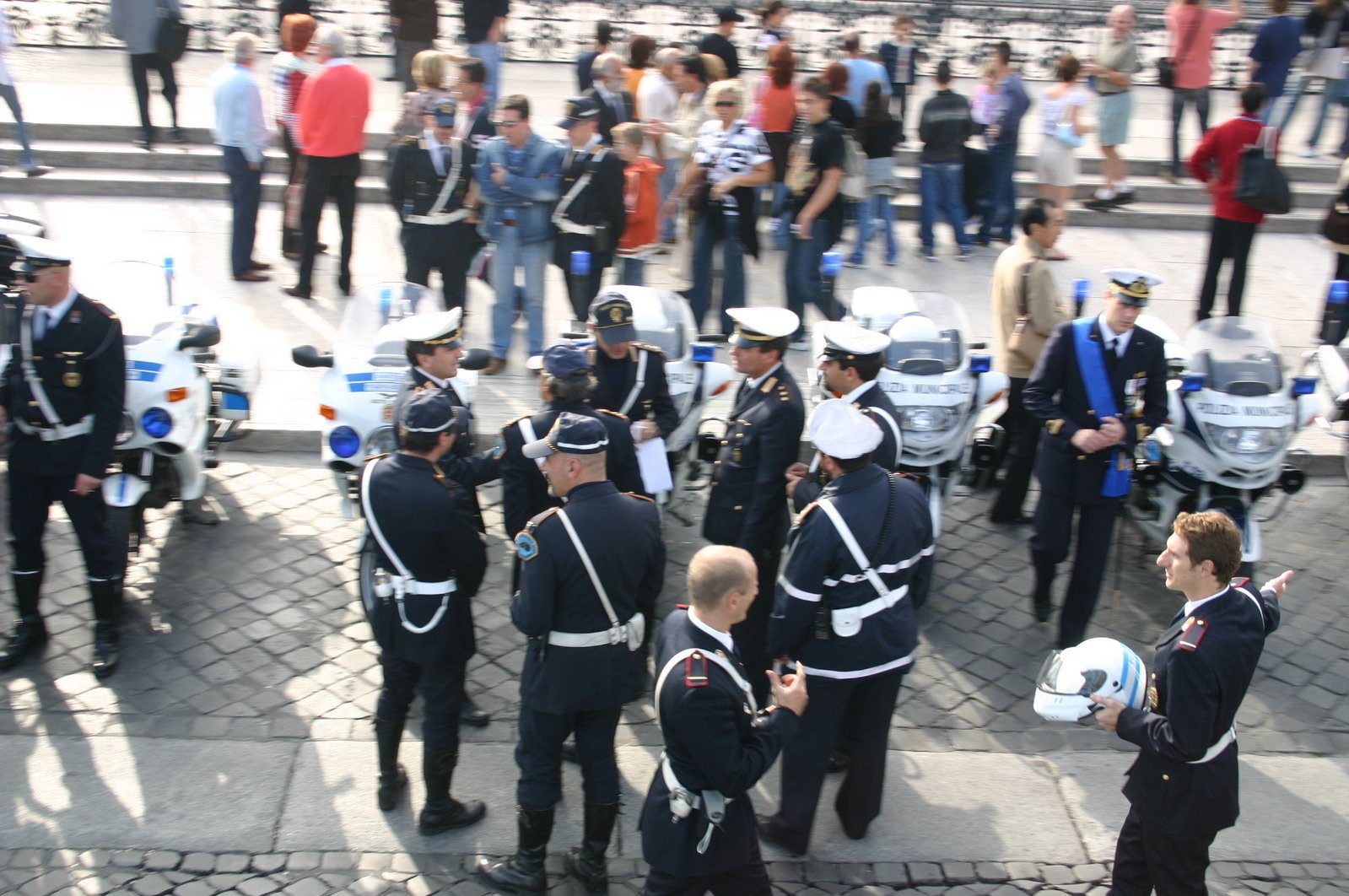 some police officers in uniform are standing in a circle