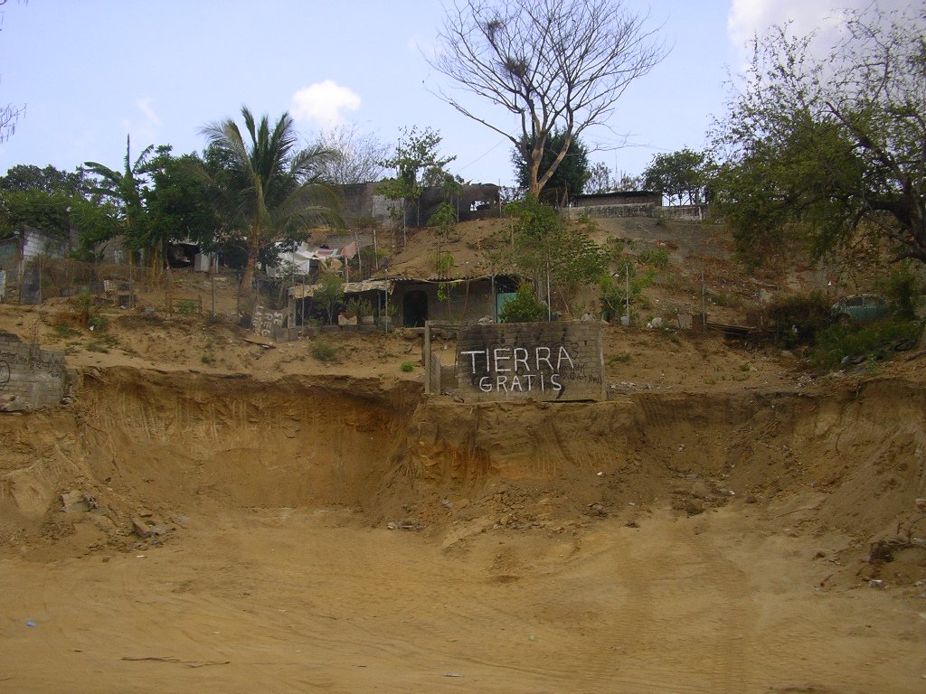 a sign that is on the side of a hill