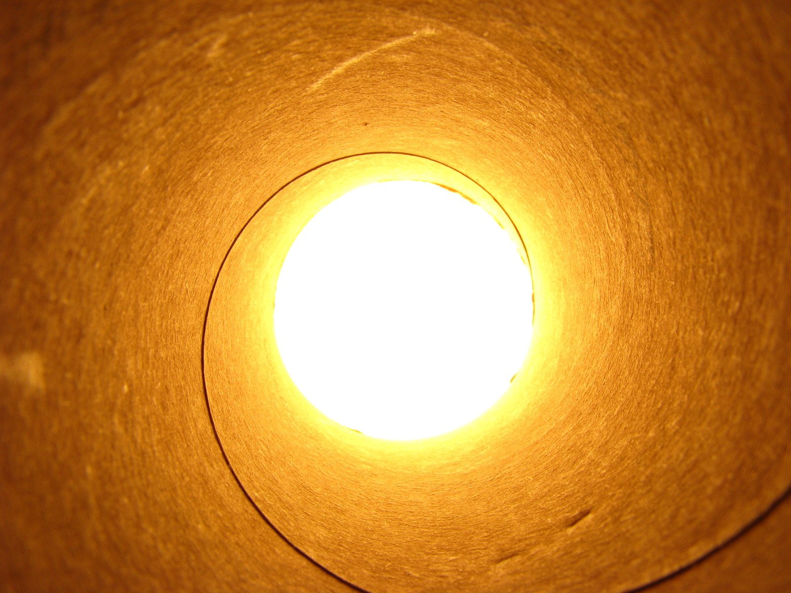 an orange round light sitting on top of a table