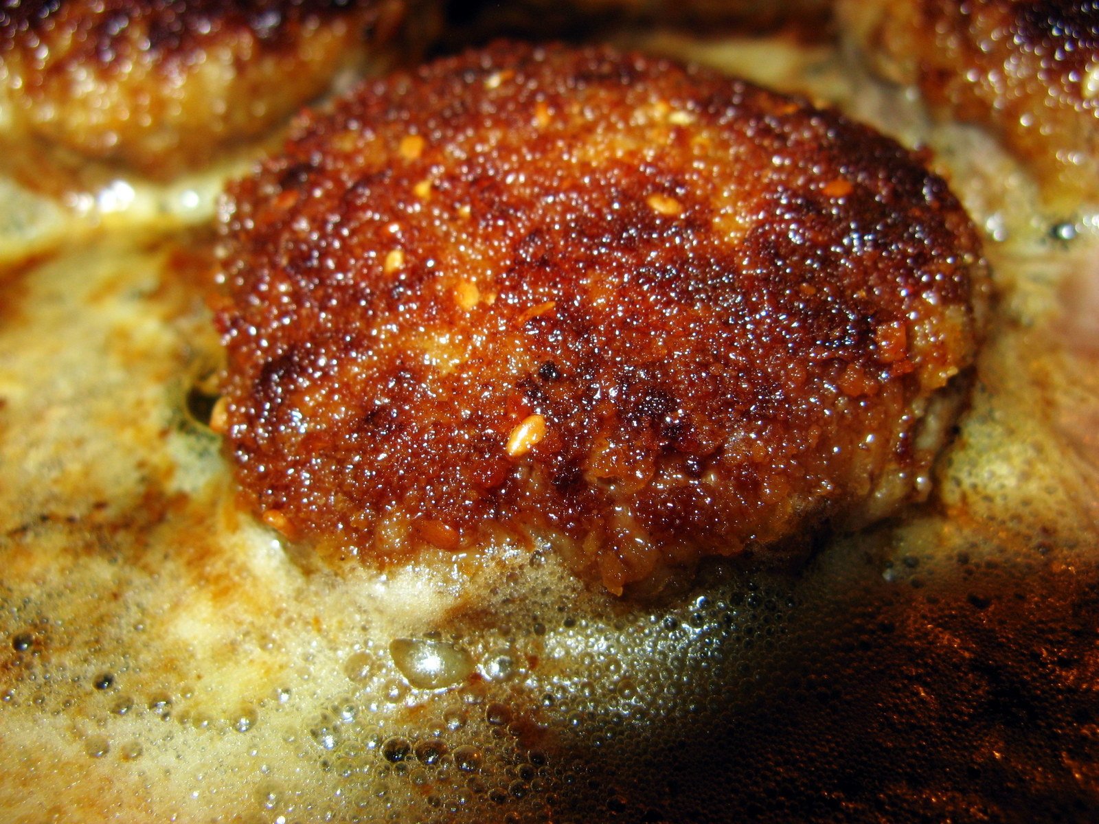 some brown and brown patties on top of some kind of food