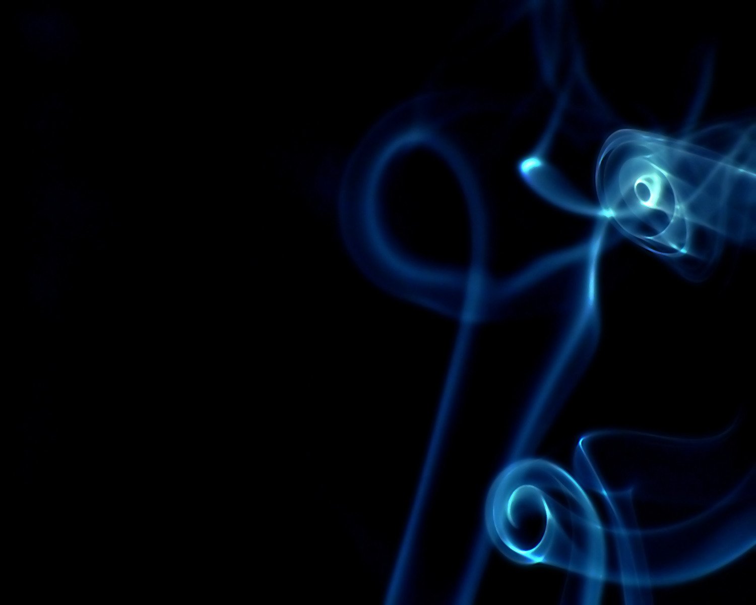 a bunch of blue smoke against a black background