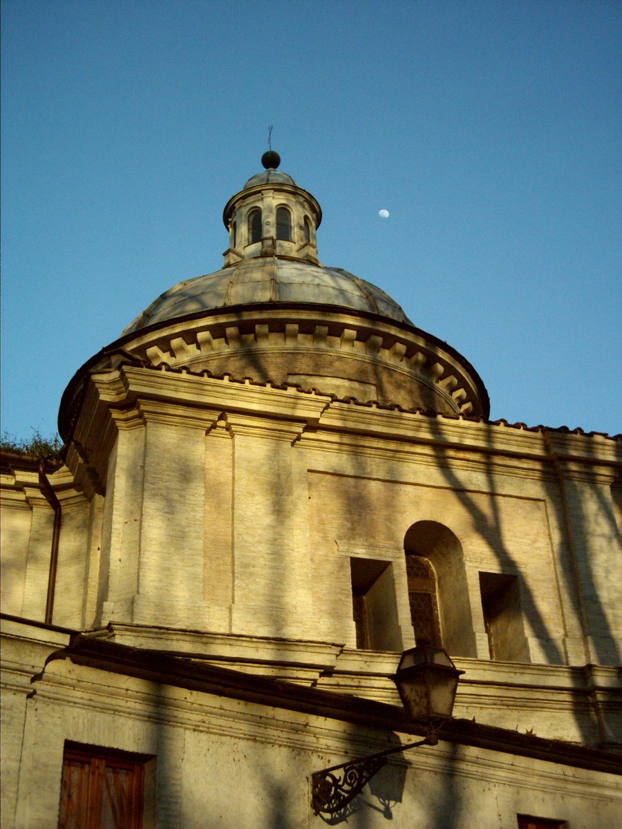 a building with a clock tower against a clear blue sky