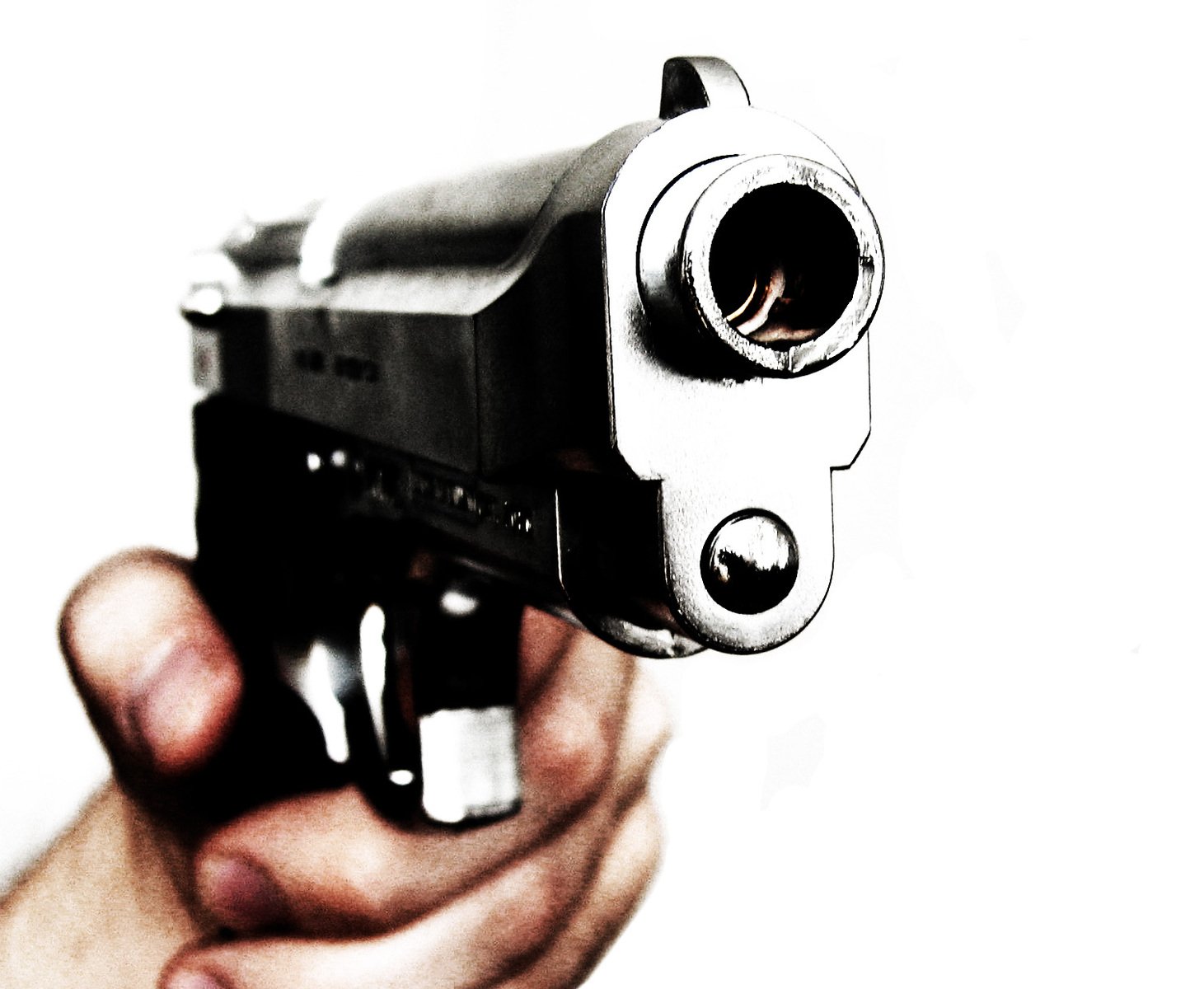 a gun being pointed at the camera with focus