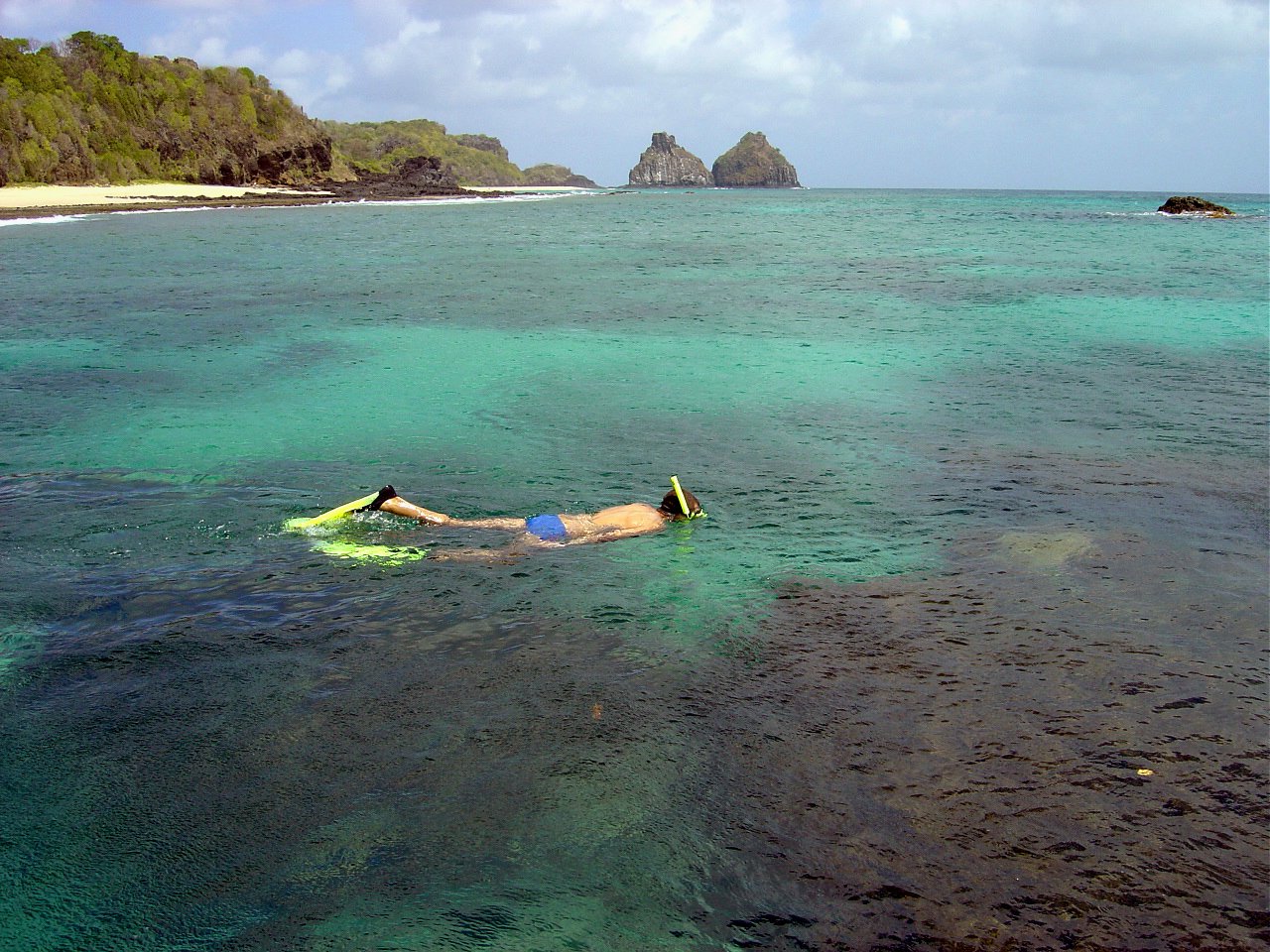 a man lying on top of a body of water