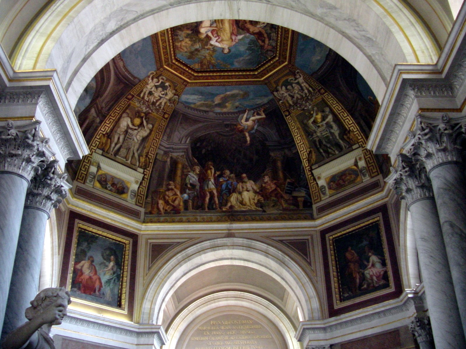 the ceiling is painted and the paintings are all over