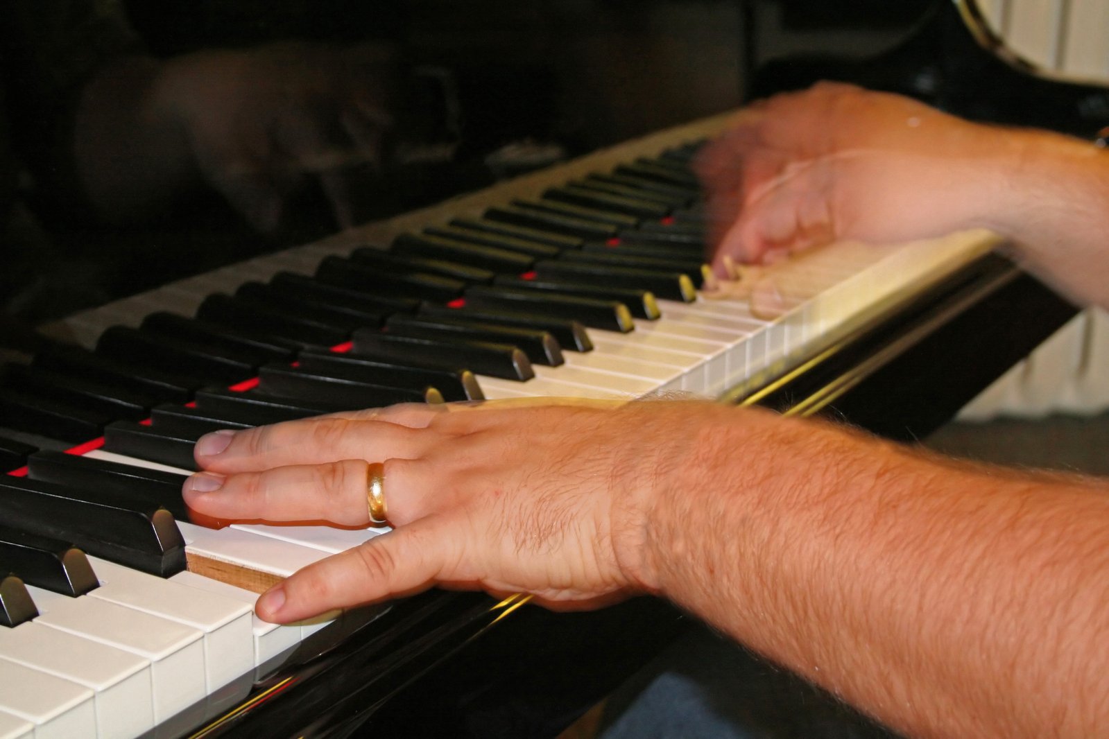 a person playing the piano with their hands