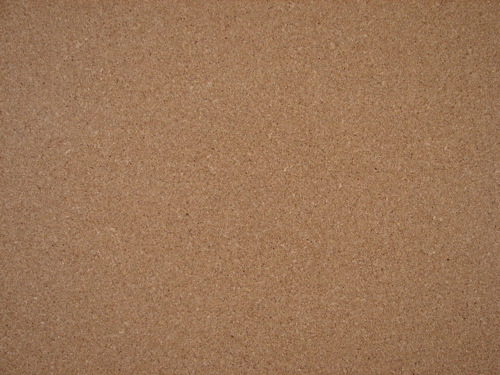 an image of a beige background with several tiny dots