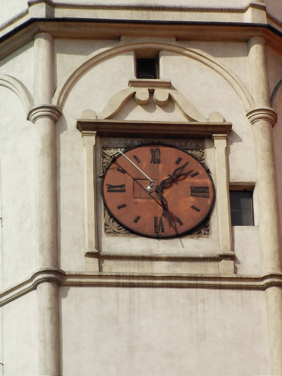 a clock on the side of a large building