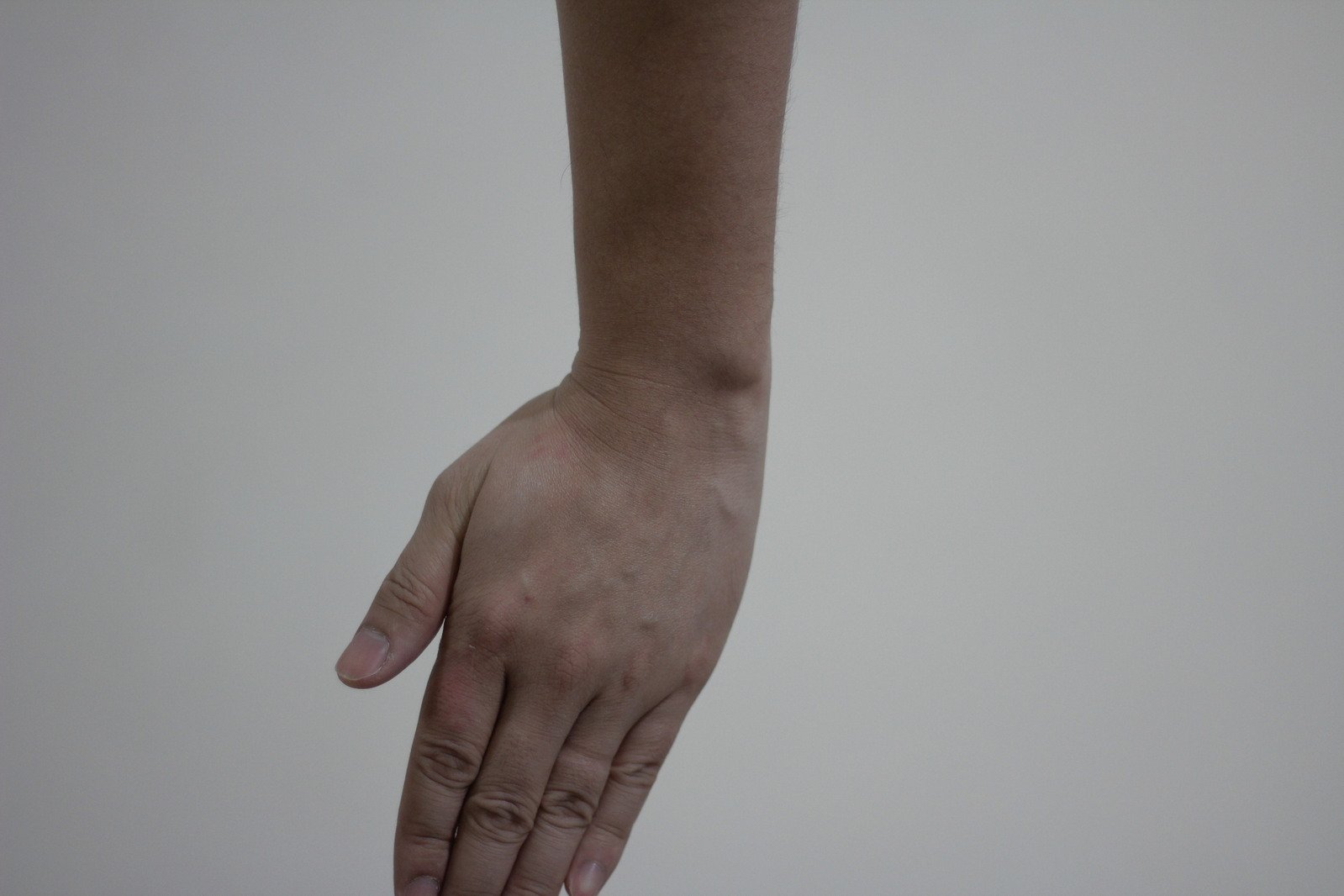 a person's hands reaching out towards the camera