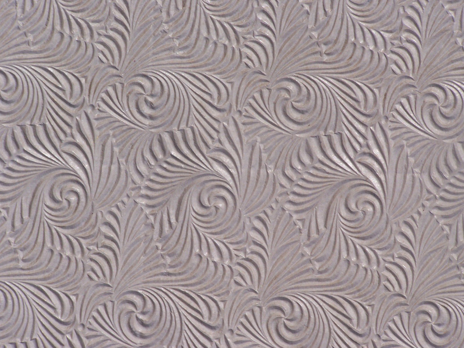 abstract pattern made up of wavy lines in grey and white
