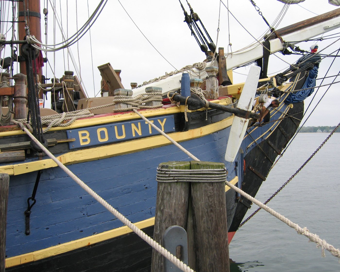 a blue and yellow boat with the name johnny in its name