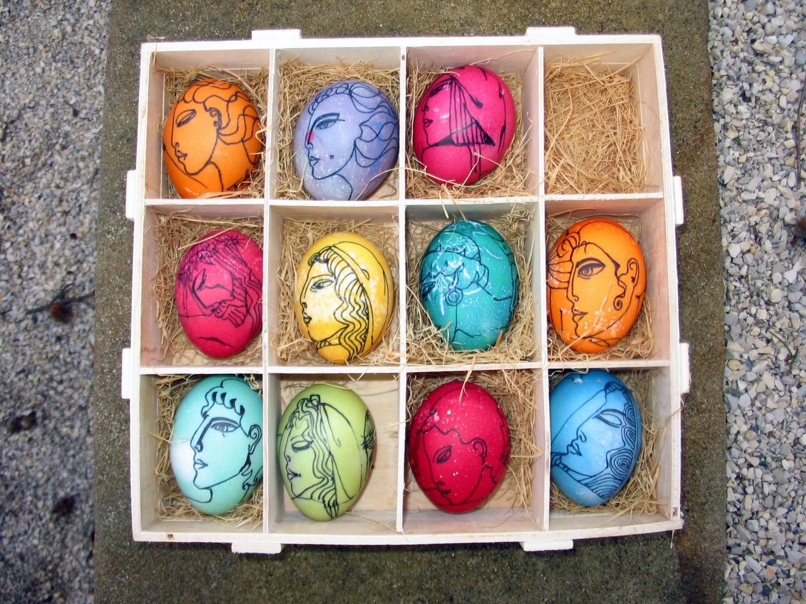 a box filled with eggs painted to look like characters