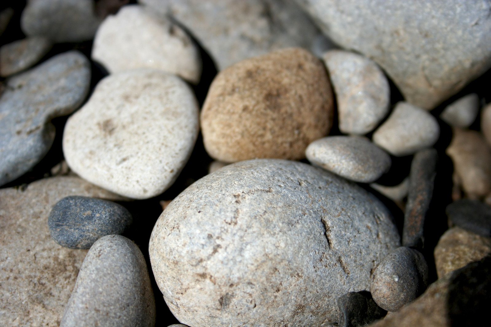 some rocks that are on a beach