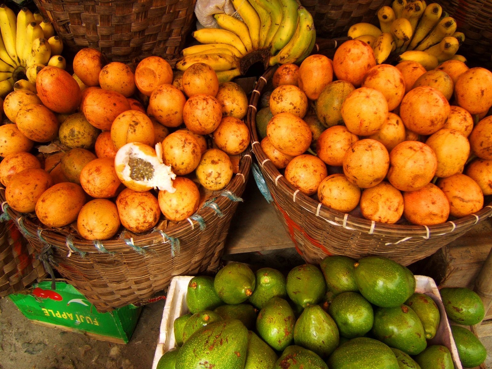 baskets filled with various types of fruit such as bananas and pears
