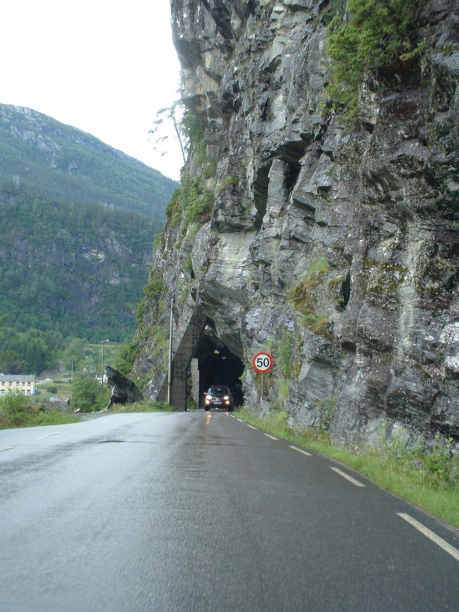 the view down a road into a cave