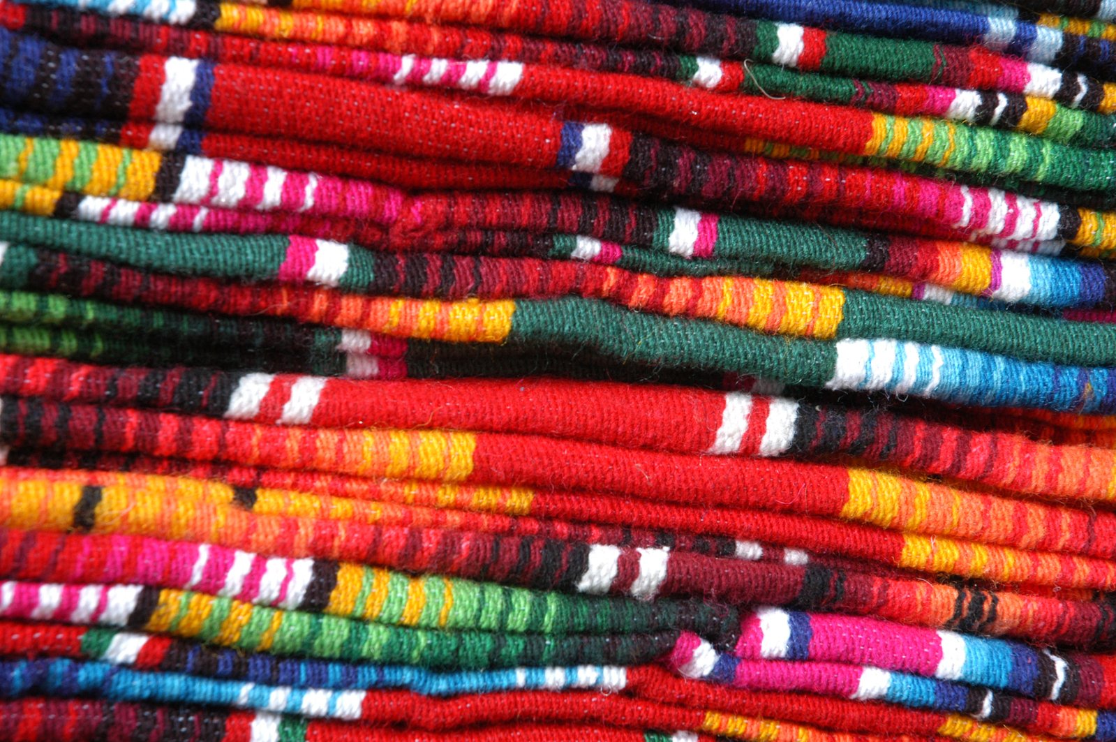 many colorful cloths that have been folded together