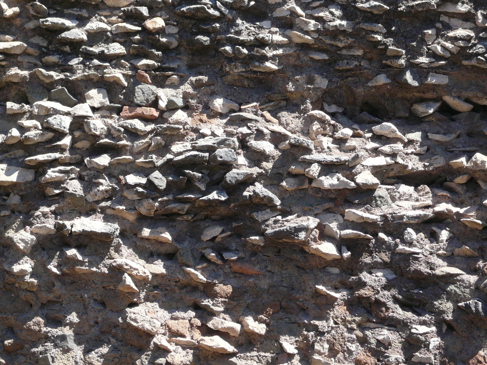 an up - close of small, broken rocks and rocks