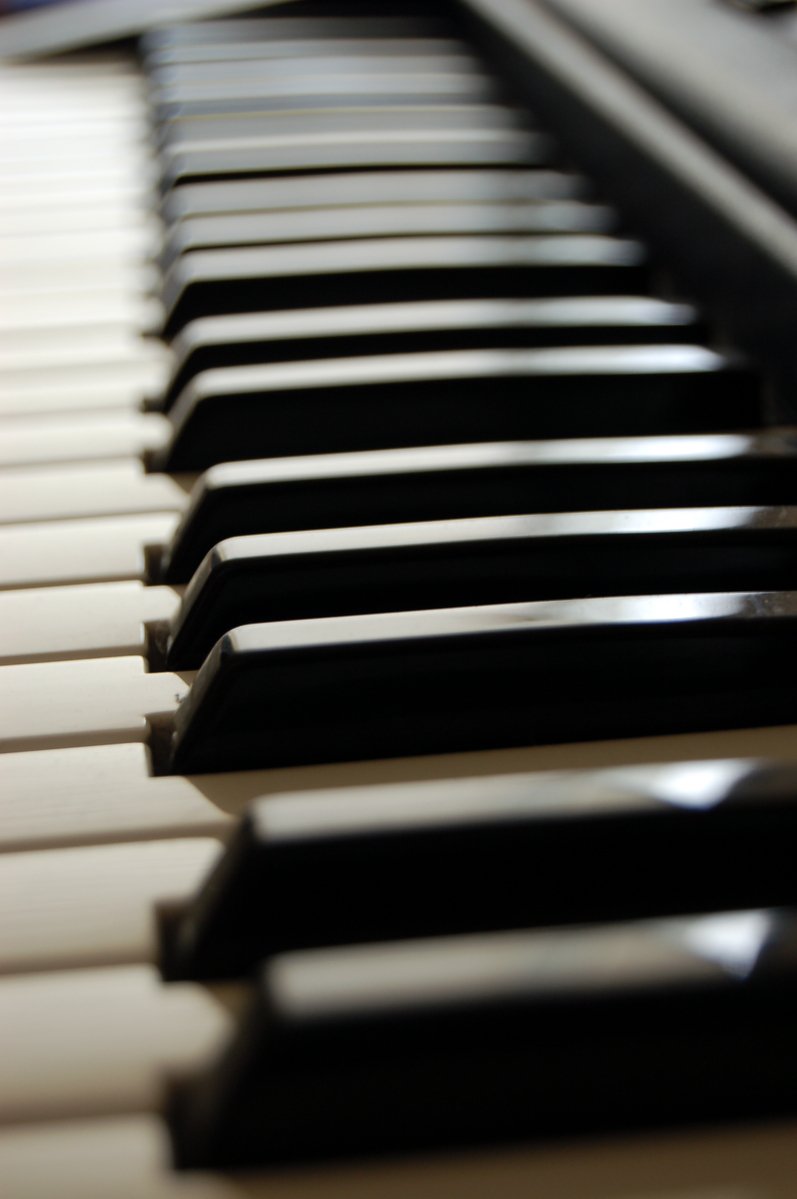 a piano with black keys on top of it