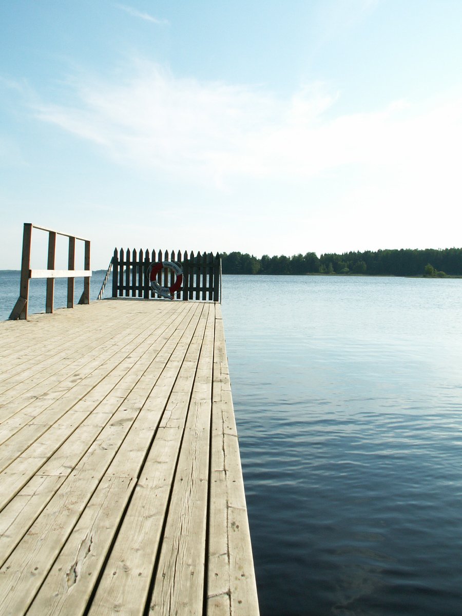 a wooden pier leading out into the water