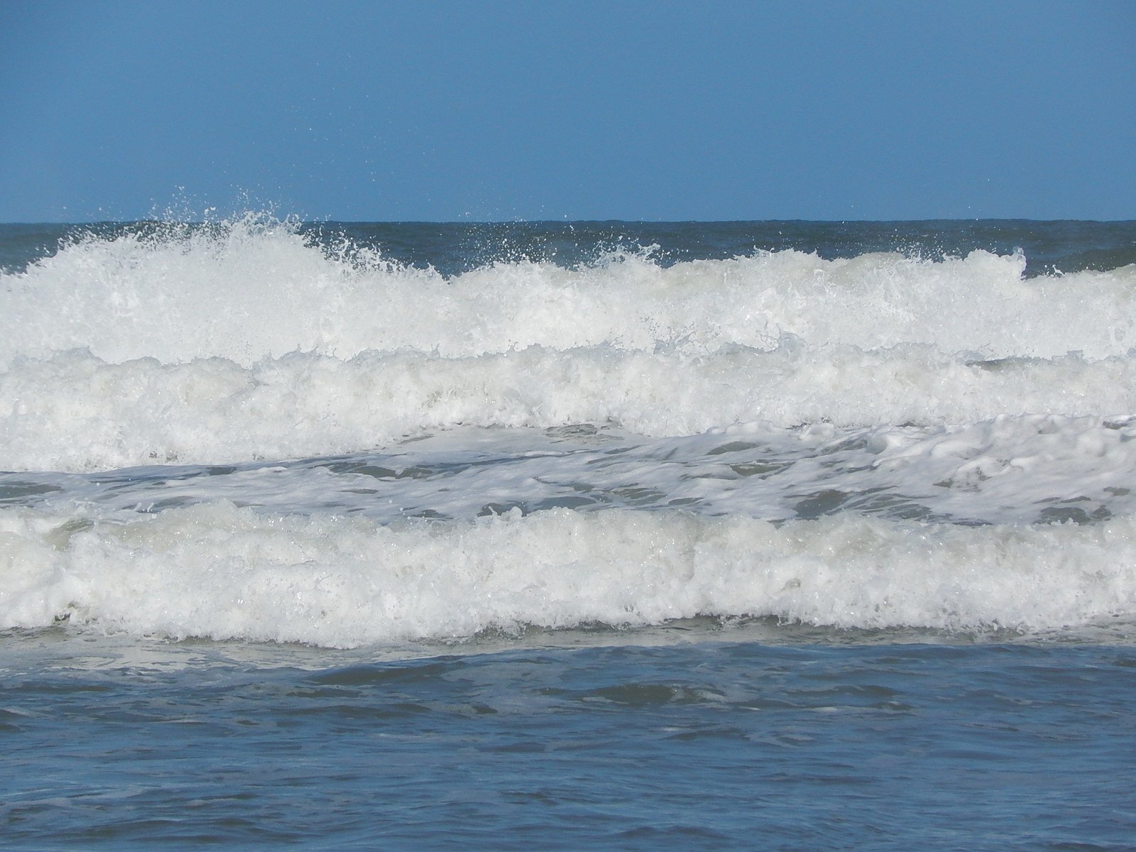 a person riding waves on their surf board