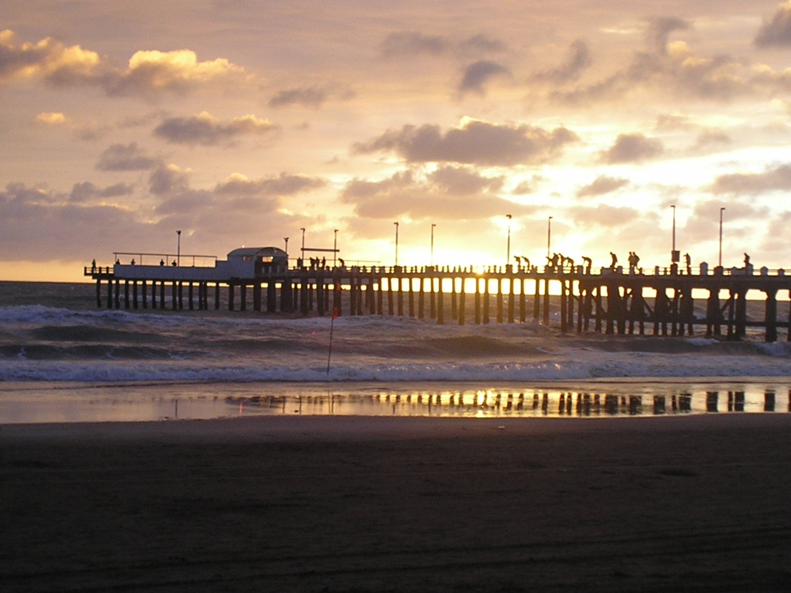 the pier is very high in the sky over the water