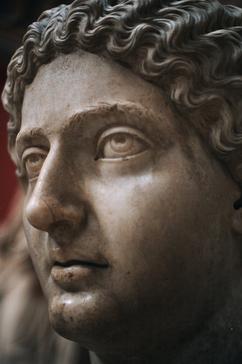 a statue of a man with curly hair