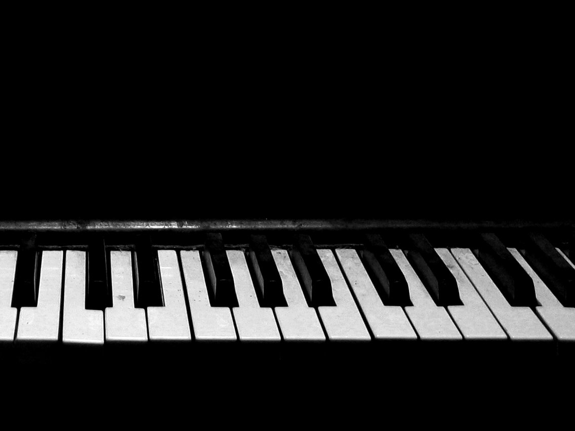 the keys of an old piano in black and white