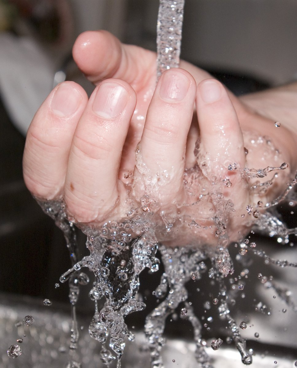 the image of water coming out of someones hand that has a spout of water