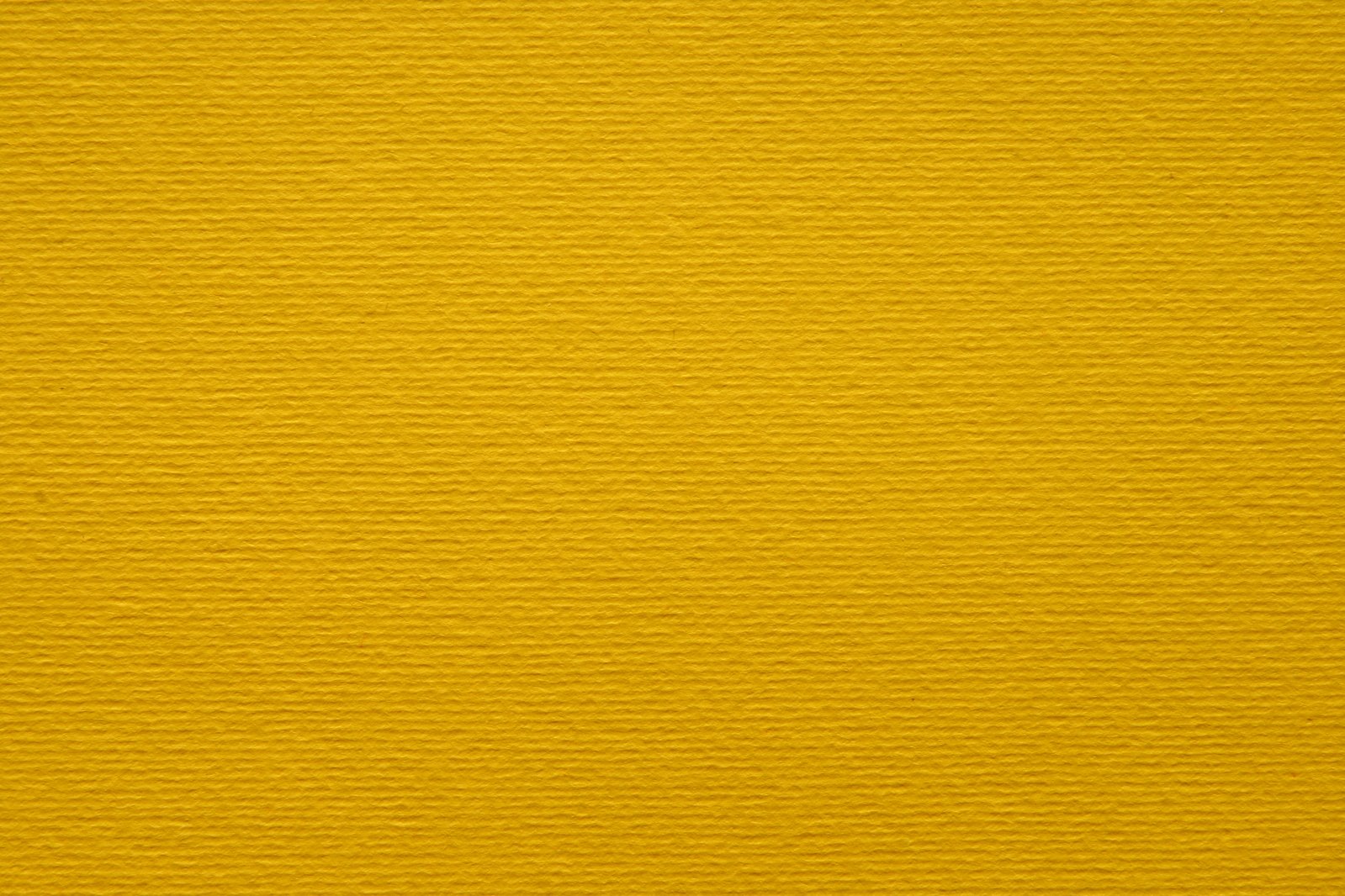 a yellow background or textured fabric with ridges