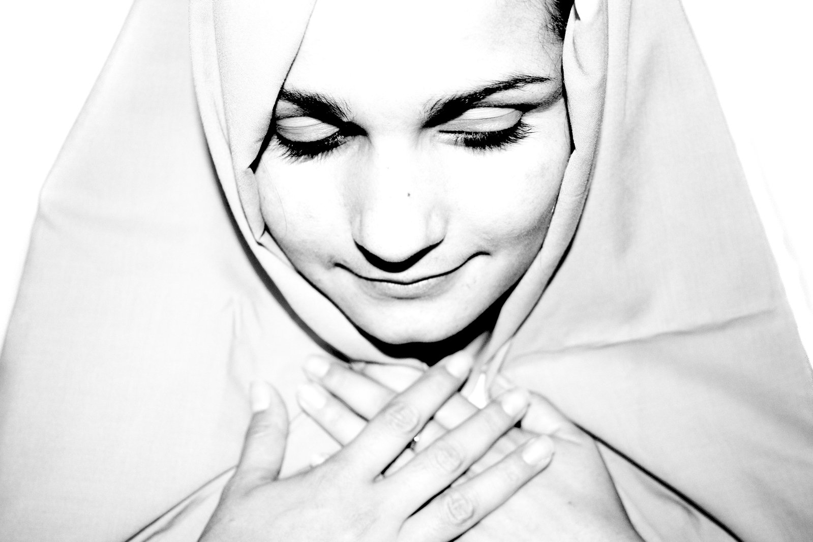 a black and white po of a woman wearing a veil