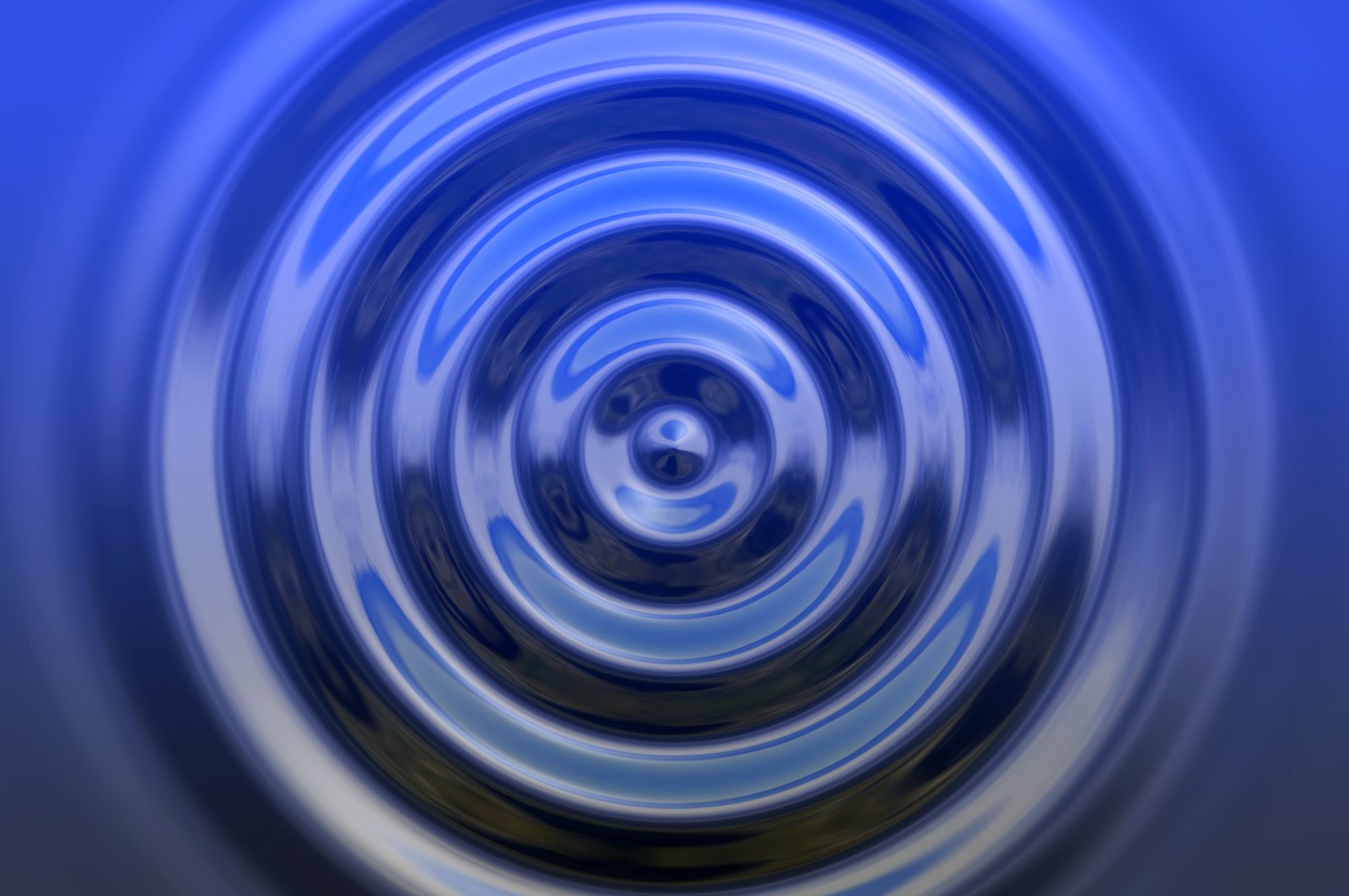 a circular, blue painting of a water surface