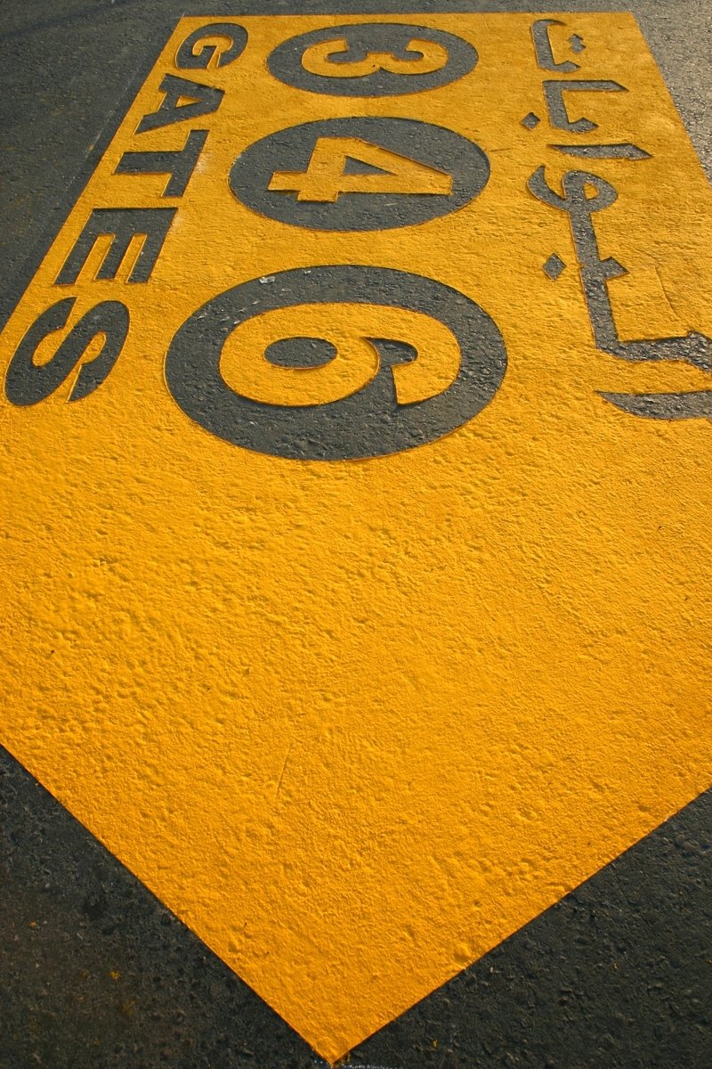 a large sign is painted onto an asphalt area
