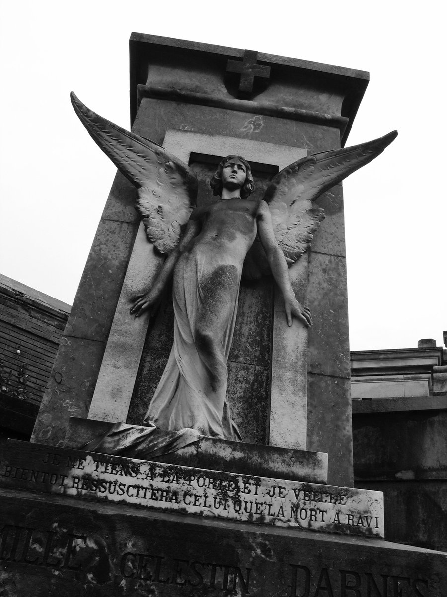a statue with an angel's head on top