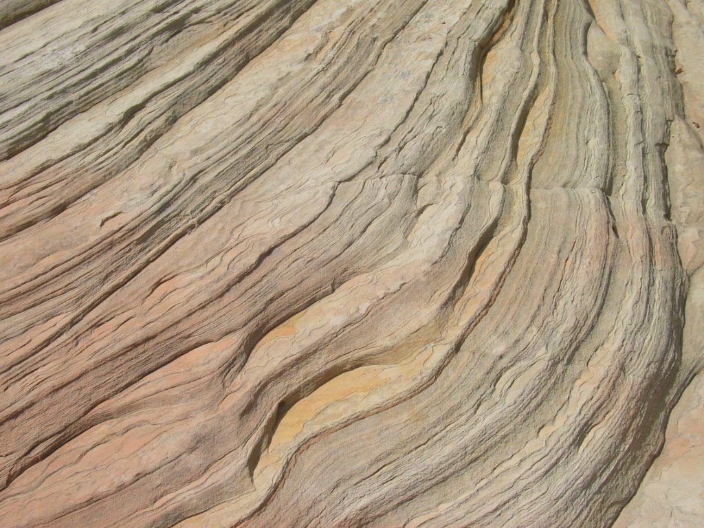 a close up view of the wavy surface of an earth rock