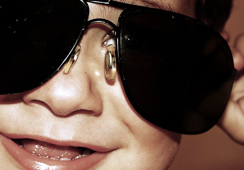 a close up of a woman wearing sunglasses