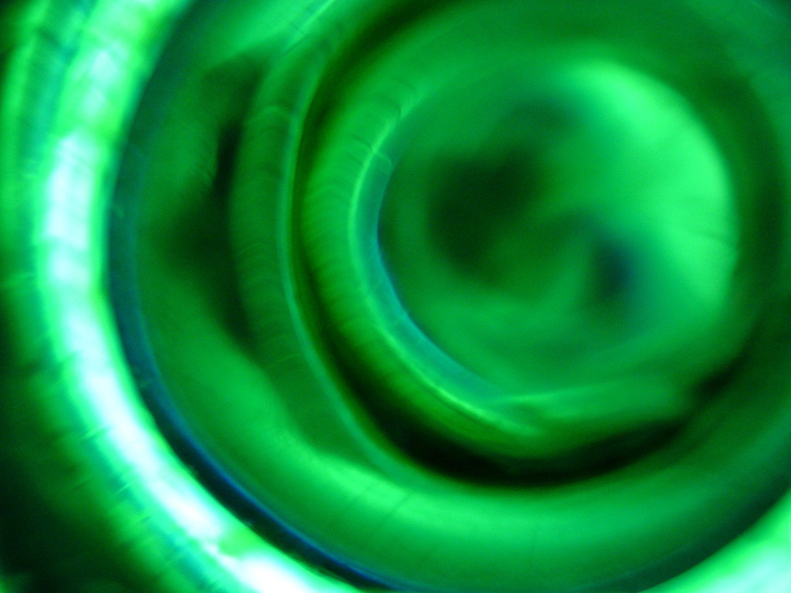 green rings moving quickly together in a blurry po