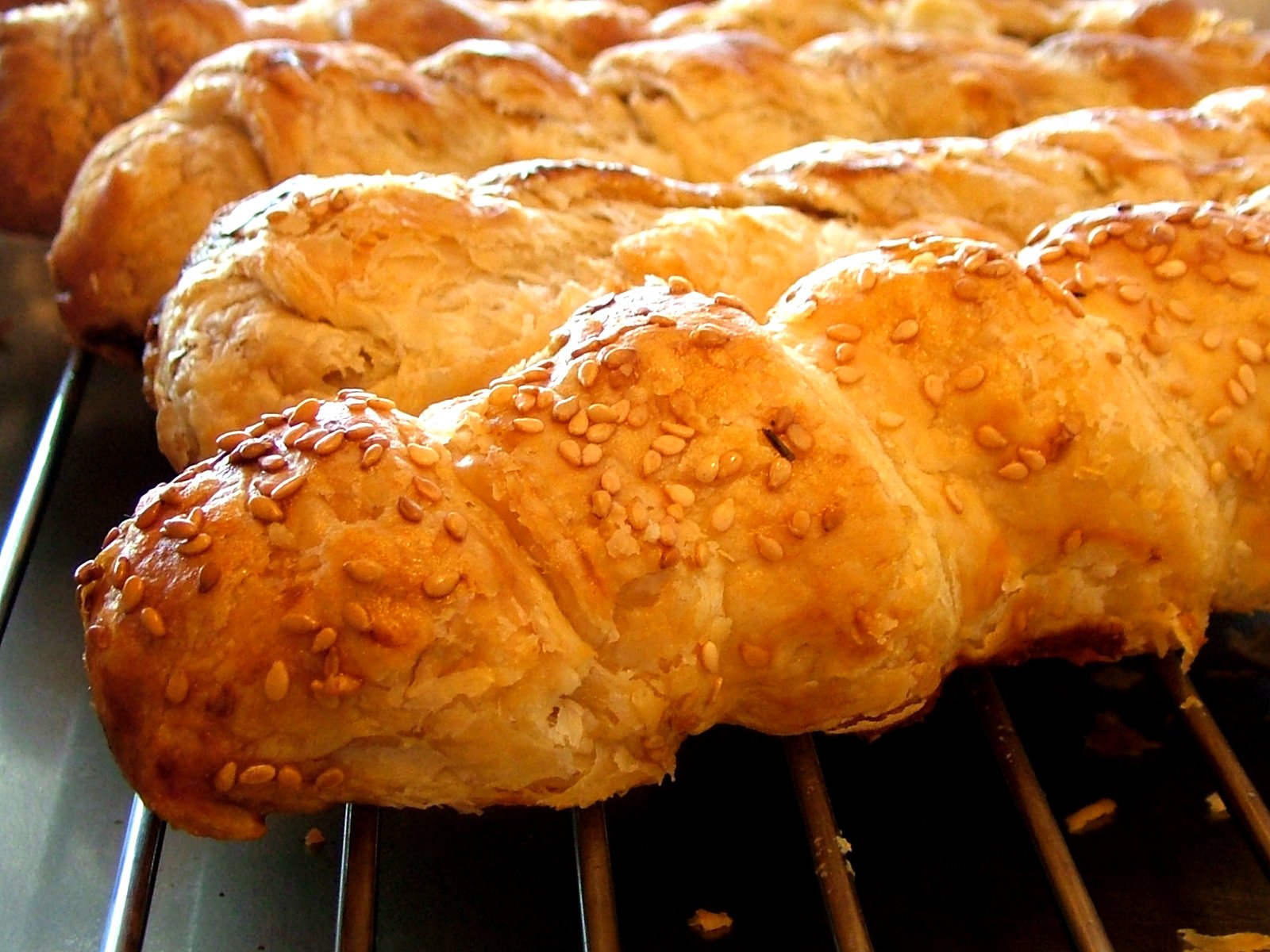 a pan filled with freshly baked pastries cooling on a wire rack