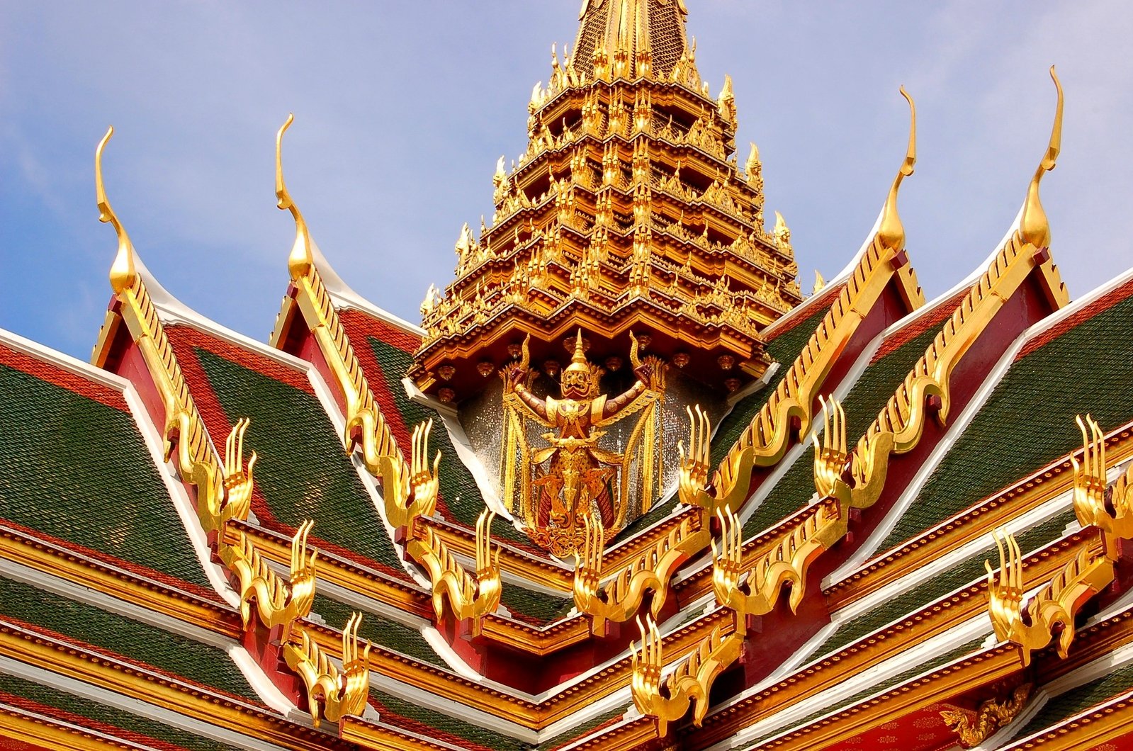 golden decorations on the roof of an ornate building