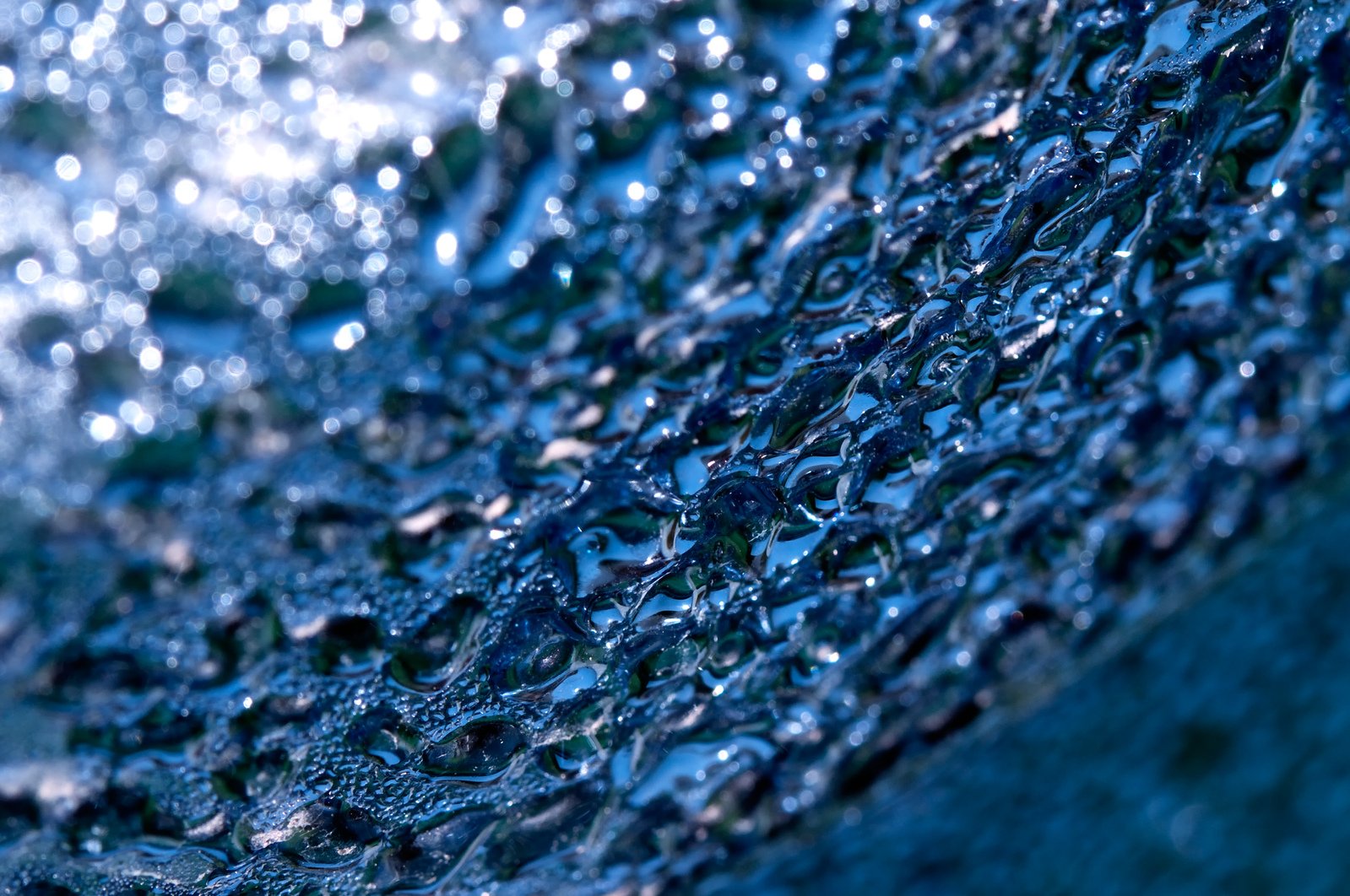 a close up image of water and rain