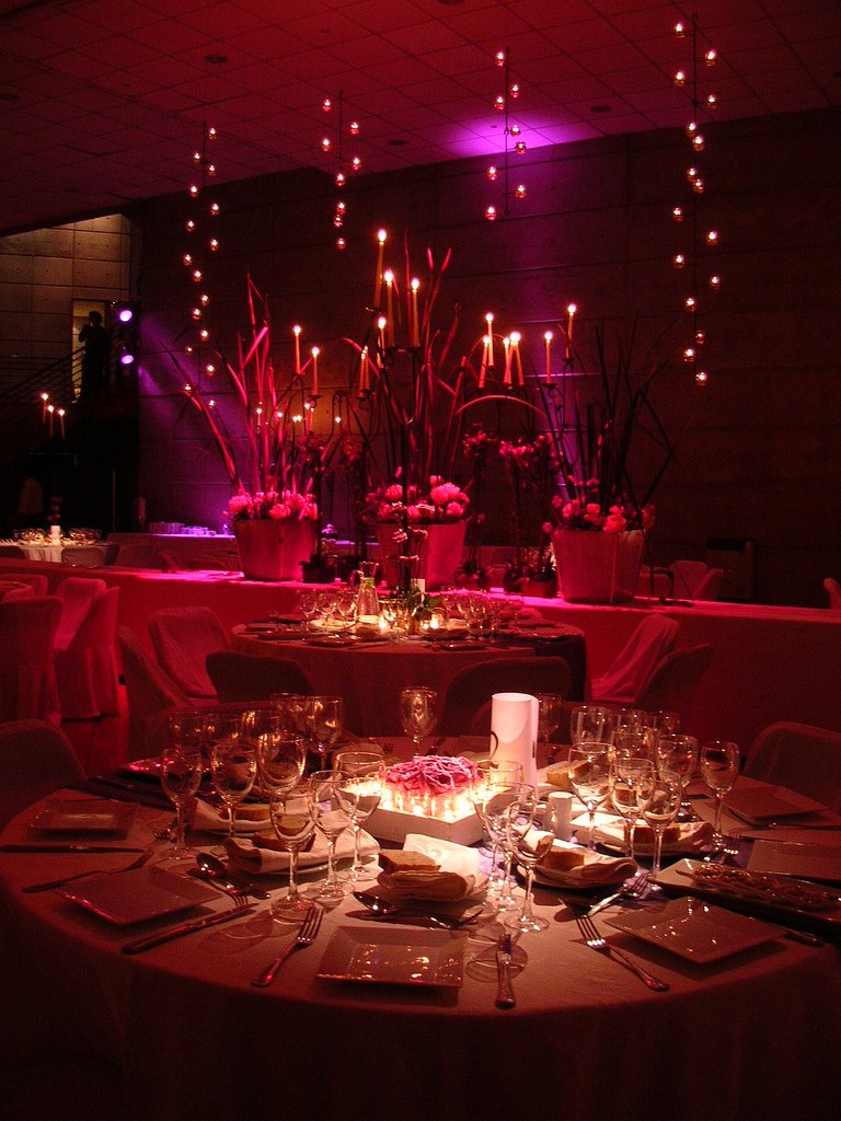 table set with champagne glasses and candles for an event