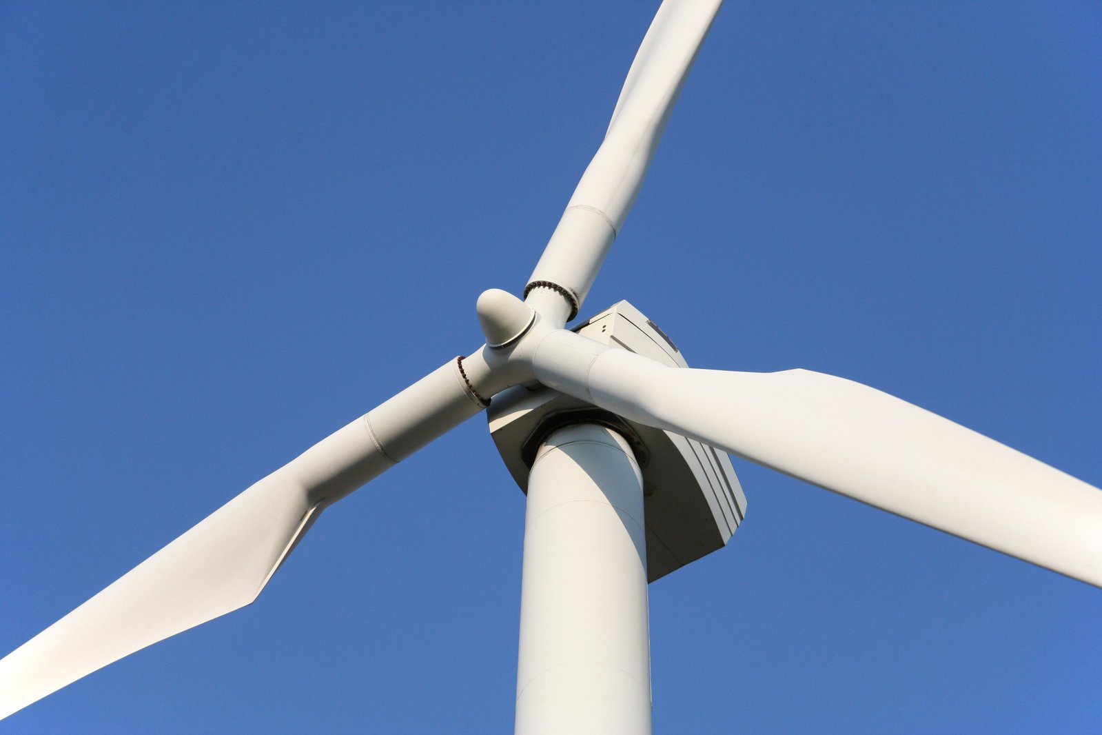 a large white windmill in the air